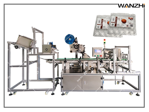 吸塑盒貼標機,水果盒貼（tiē）標機,塑料盒不幹膠貼標機